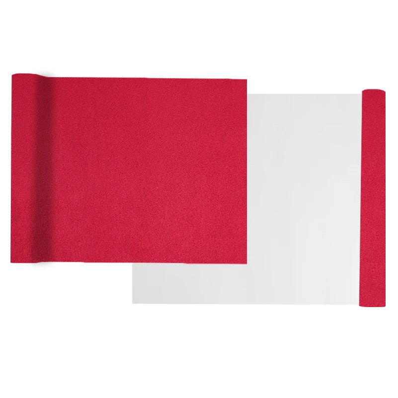 A piece of red suede wrap fabric is shown next to a white sheet, demonstrating the material for DIY projects.