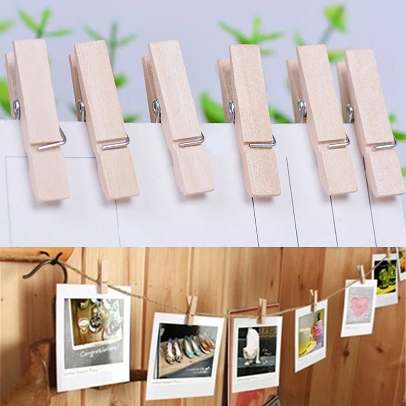A row of natural wooden mini clothespins in light beige color displayed on a white background.