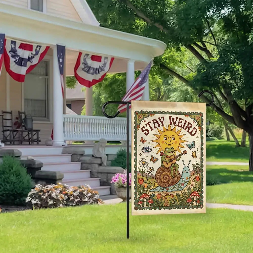 A vintage garden flag featuring a yellow sun, a green lizard, and a snail on a floral background.