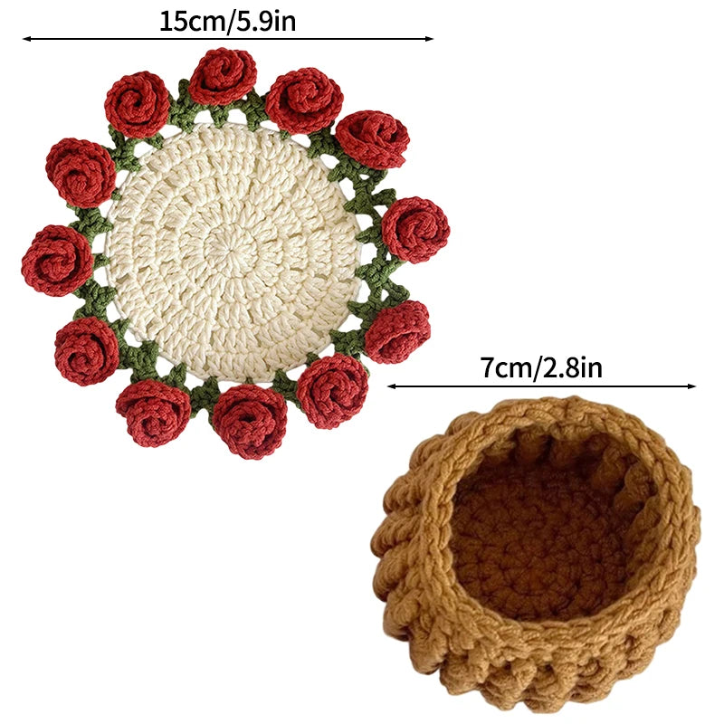 Hand-crocheted rose flower coasters featuring a cream center surrounded by red and green yarn.