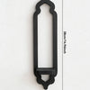 A black wooden arch-shaped wall shelf with a decorative top and bottom