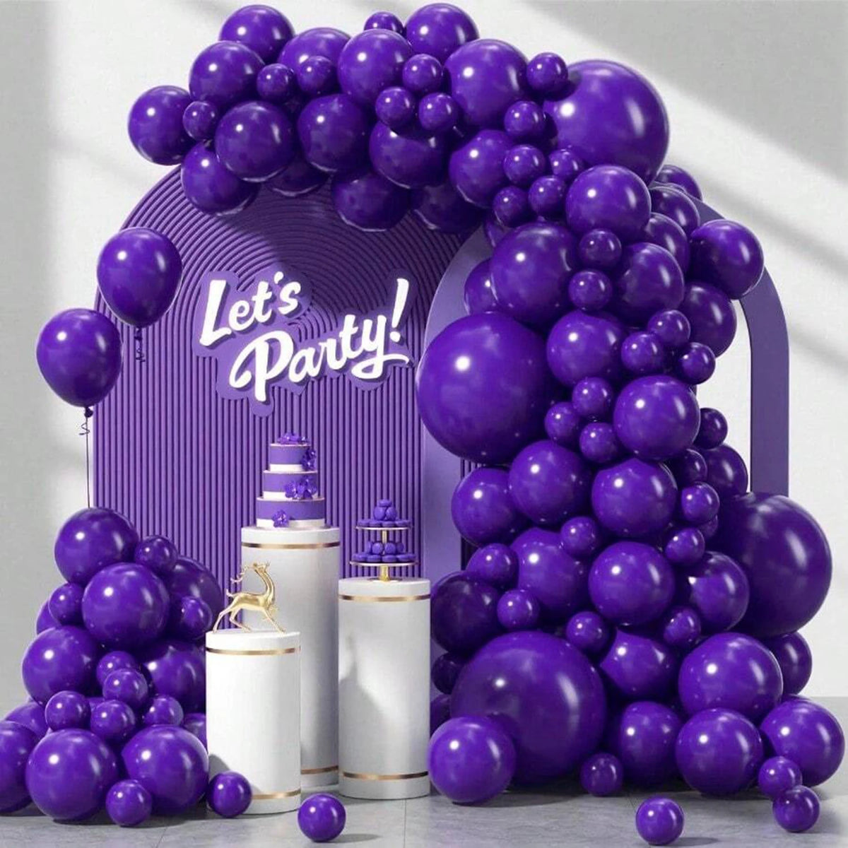 A large arrangement of dark purple latex balloons forming a decorative arch and cluster for party decor.