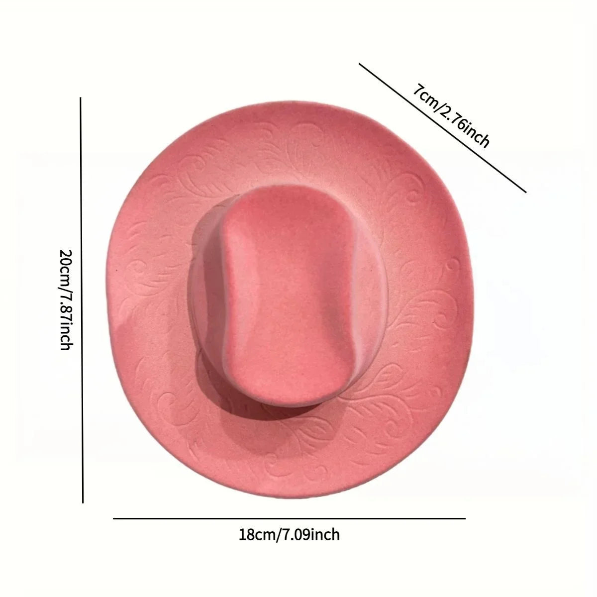 A round, pink resin wall vase holder with a smooth, oval depression and decorative embossed patterns.