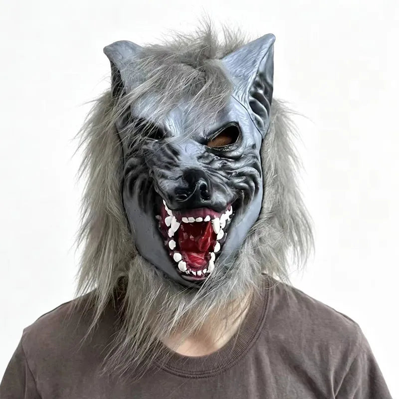 A realistic werewolf full head mask with gray fur and black features worn by a person.