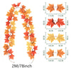 Artificial autumn maple leaf vine with varying orange and yellow colors shown with size measurements.