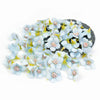 A cluster of light blue silk artificial flower heads with yellow centers arranged on a dark surface.