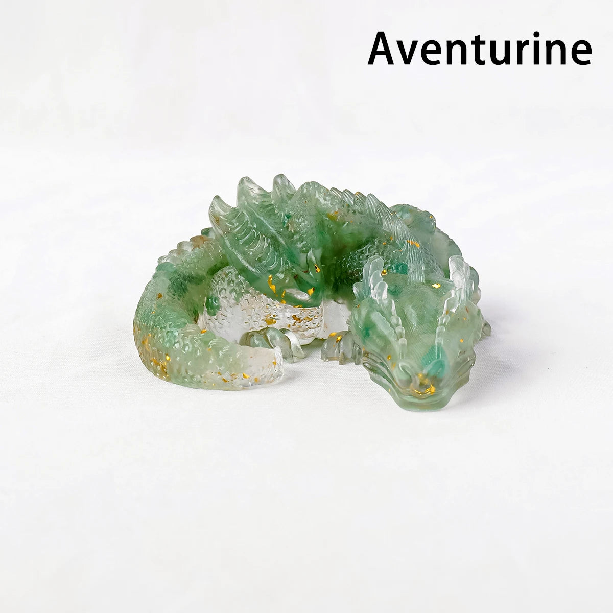 A green Aventurine crystal dragon figurine with gold accents, displayed on a white background.