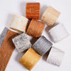 A collection of self-adhesive PVC corner trim pieces in various wood and stone textures and colors.