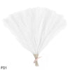 A bundle of white artificial pampas grass reeds tied together for home and event decor.