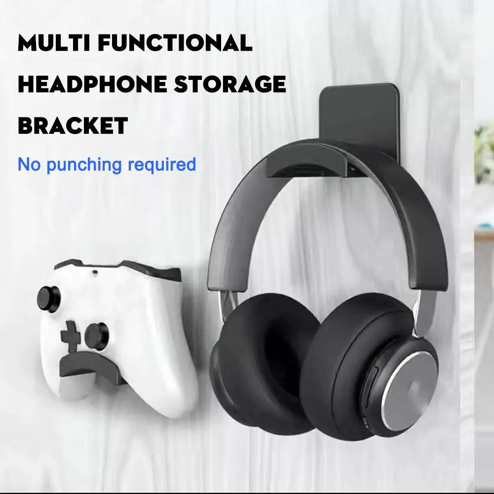 A black headphone storage bracket is shown mounted on a white electronic device.