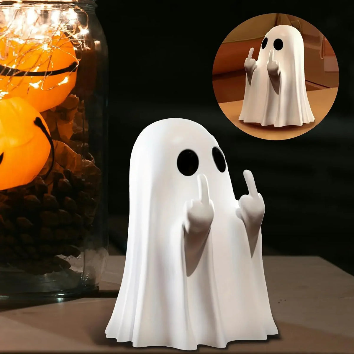 A white ghost figurine with a sassy hand gesture is shown next to a glass jar filled with orange lights.