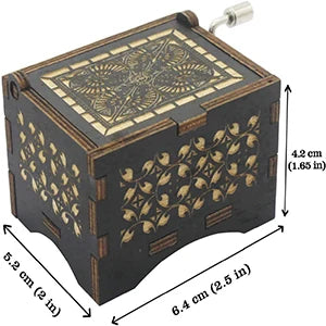 Antique wood music box with engraved melody featuring intricate patterns on the lid and body.
