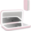 A pink portable touch screen makeup mirror with a light gray display showing 10x and 1x magnification settings.