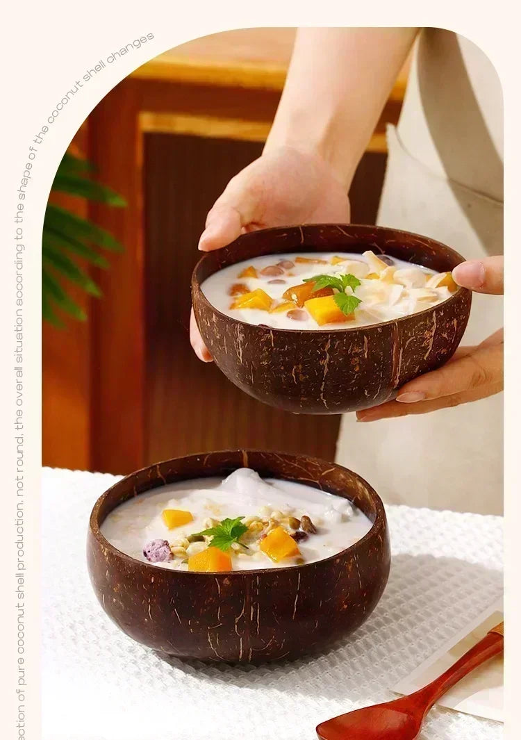 Three dark brown coconut shell serving bowls filled with a creamy, orange-colored food mixture.