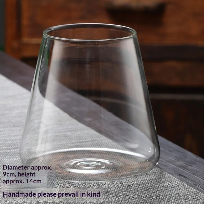 A clear glass vase with a tapered shape is shown on a table, with dimensions listed.