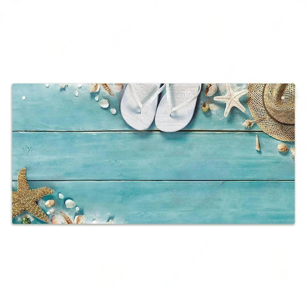 A light blue wooden sign decorated with seashells, starfish, and straw hats.