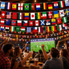 A group of people cheering while viewing a large banner displaying numerous international flags.