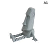 A gray 3D printed Moai statue figurine with movable joints.