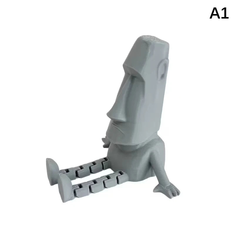 A gray 3D printed Moai statue figurine with movable joints.