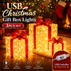 A set of three glowing red LED gift box lights with USB power and Christmas decor elements.