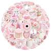A collection of cute pink graffiti stickers and accessories including jewelry, lip balm, and decorative items.