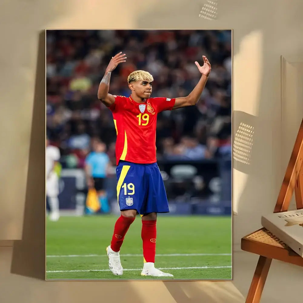 A poster featuring Lamine Yamal in a red and blue soccer uniform standing on a green field.