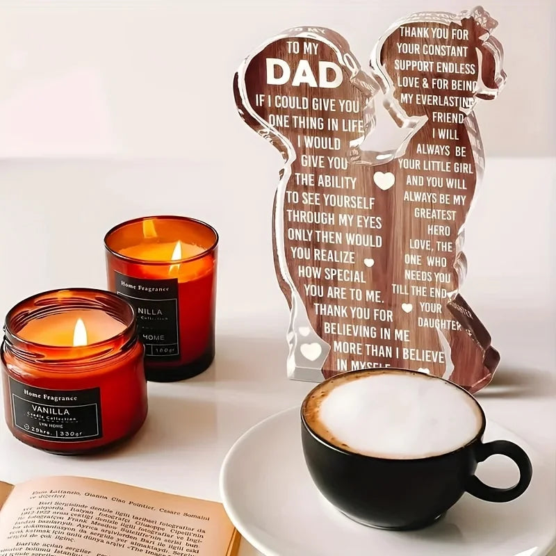 A wooden acrylic sign shaped like a lion, engraved with a message to Dad, placed next to a mug of coffee.