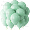 A cluster of light sage green latex balloons tied with green ribbons.