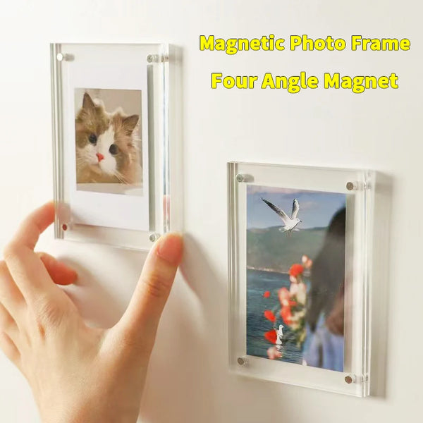 A hand is holding a transparent acrylic photo frame with a cat picture inside, demonstrating the magnetic photo frame.