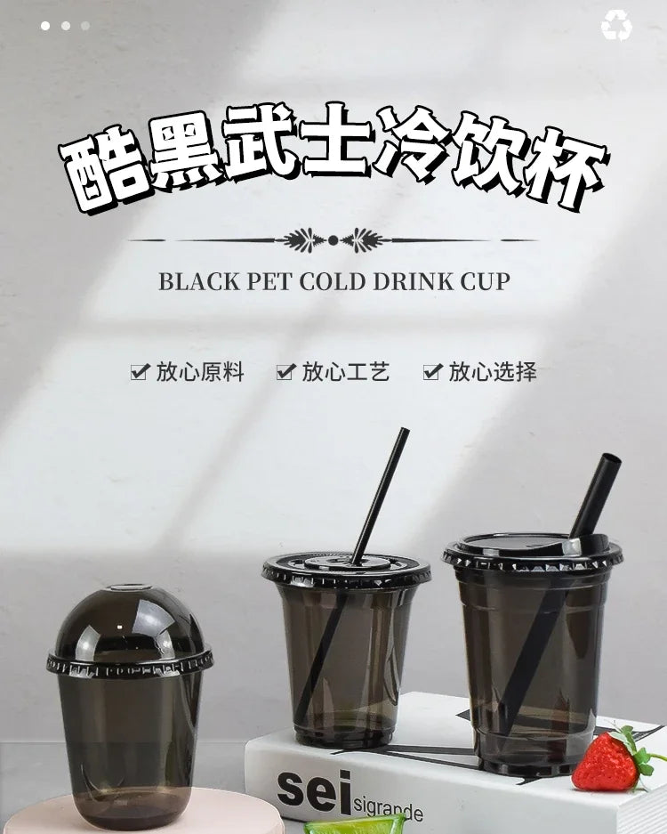 Three black disposable U-shaped drink cups are displayed on a white surface.