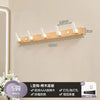 Walnut wood coat rack with 8 hooks and storage shelf mounted on a wall