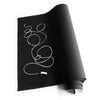 A roll of removable self-adhesive chalkboard wall stickers lying on a white surface.