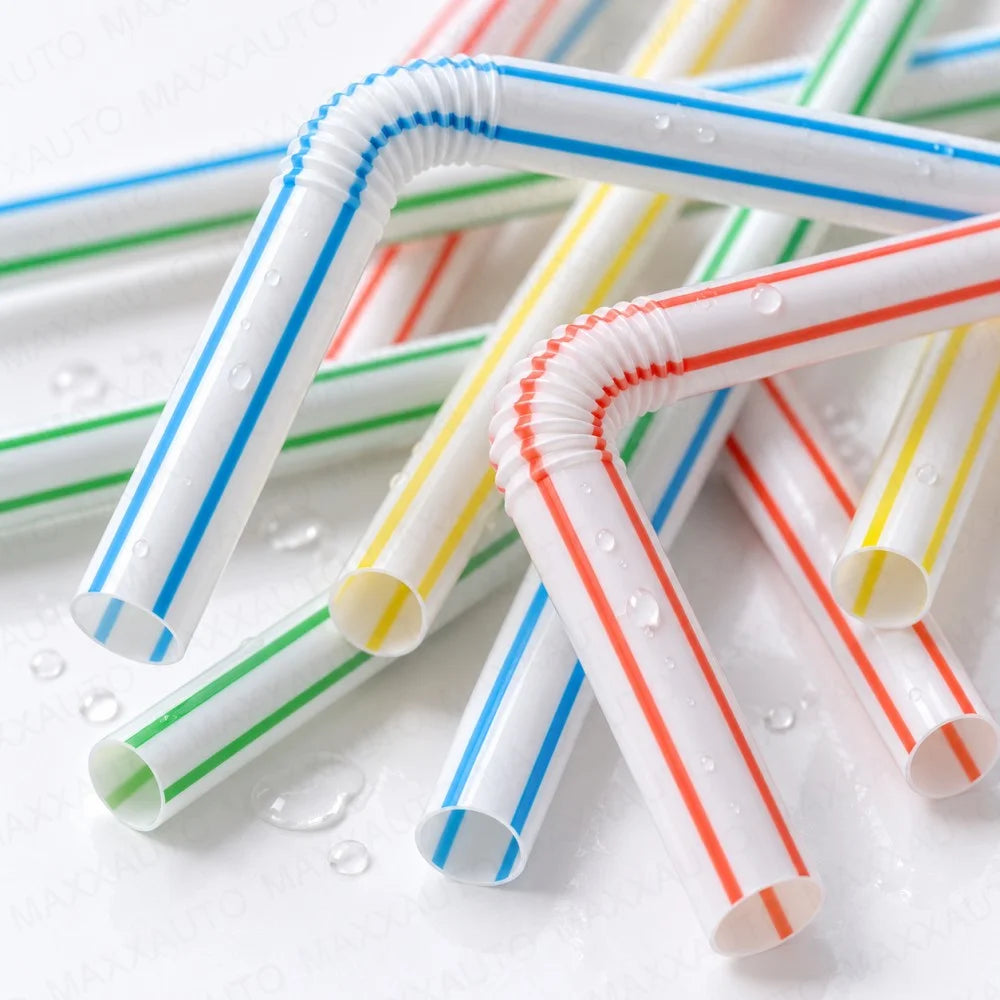 A collection of flexible reusable drinking straws in various striped colors like white, red, and green.