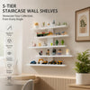 Five-tier staircase wall shelves displaying various decorative items and collections.