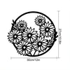 Black metal flower wall art set featuring three detailed floral designs.