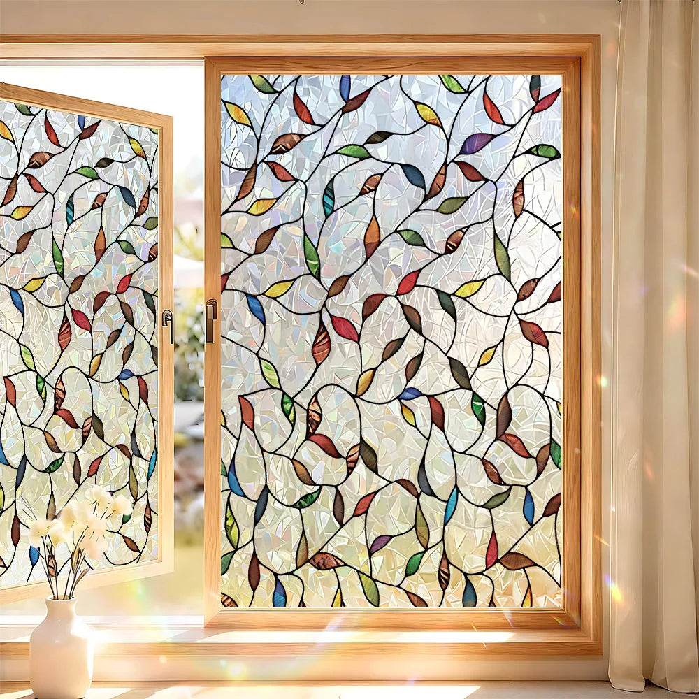 Decorative privacy window film featuring a pattern of colorful leaves and branches in a wooden frame.