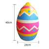 A colorful foil balloon shaped like an egg with yellow, pink, and blue chevron patterns.