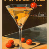 A vintage cocktail glass filled with an orange-colored drink sits on a wooden surface with citrus fruits.