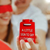A hand holds a red 3D printed letter sign ornament that reads A LITTLE SIGN TO SAY I LOVE YOU