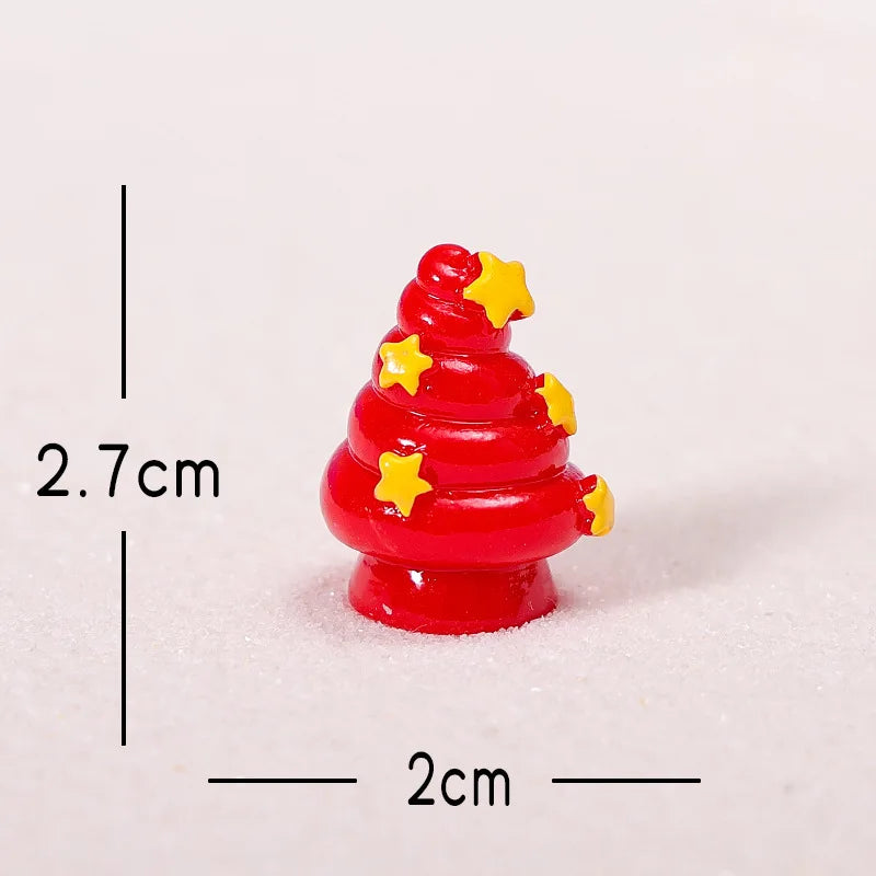 A small, red resin Christmas tree charm decorated with yellow stars, shown against a white background.
