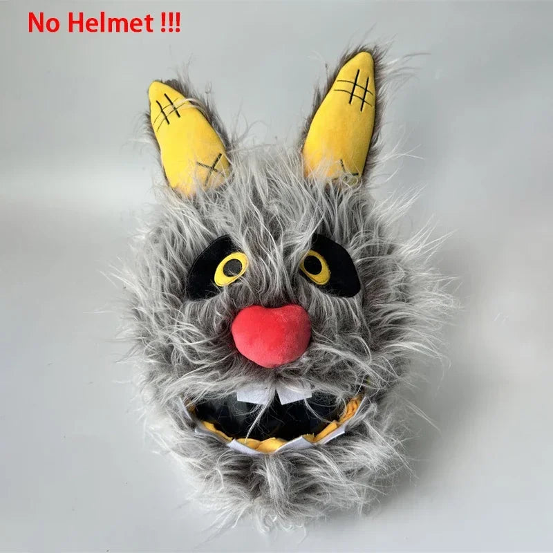 A gray cartoon plush with yellow horns and a red nose, designed as a helmet cover.