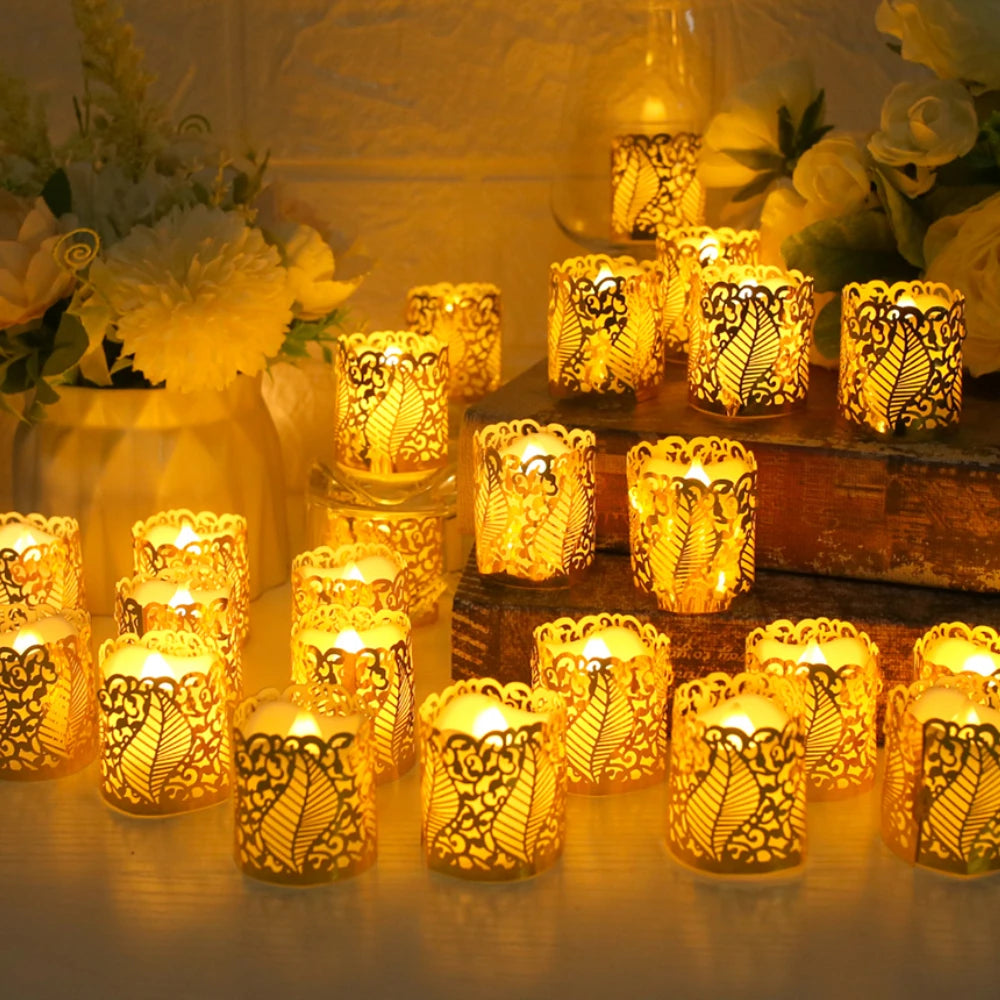 A collection of glowing yellow LED tea light candles in decorative paper lampshades arranged on a wooden surface.