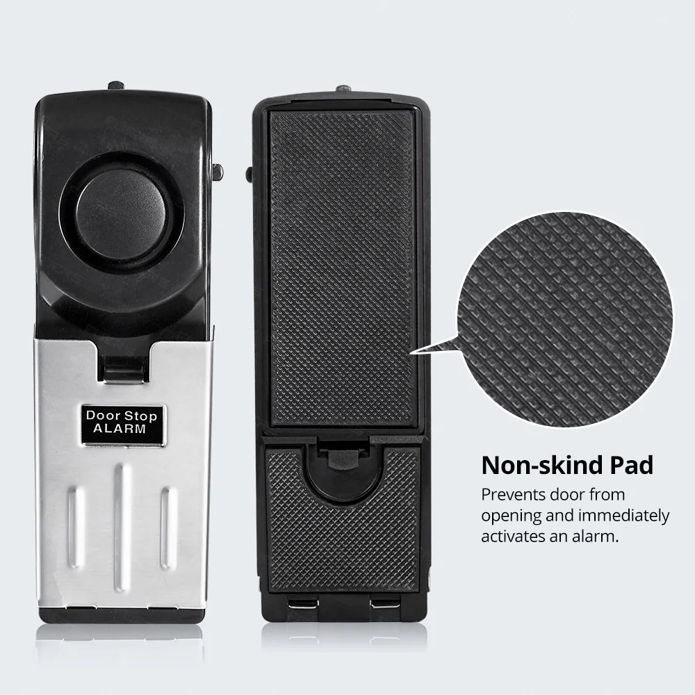 A black door stop alarm unit and a non-skid pad are shown side by side.