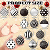 A collection of various size and patterned polka dot winter ball Christmas ornaments displayed in a hand.