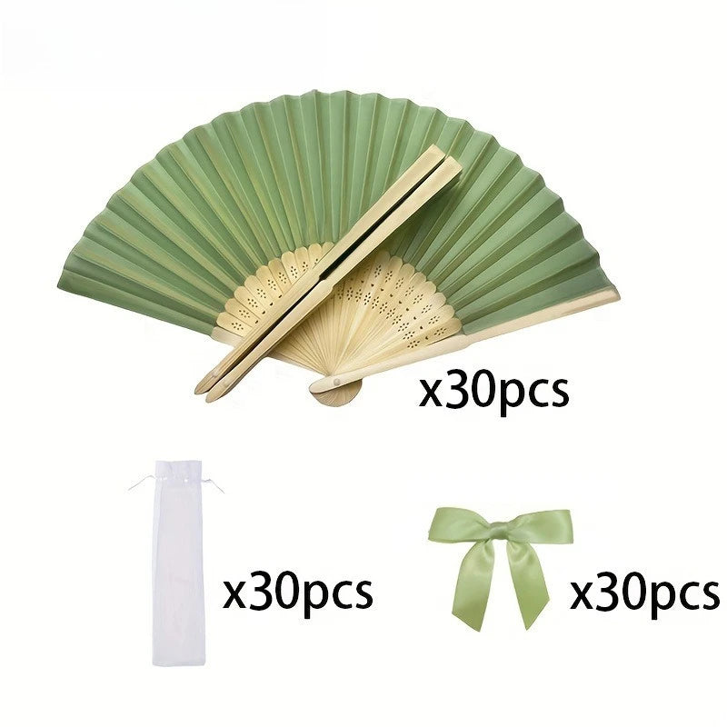 A set of three light green folding hand fans, including a large fan and two smaller fans, packaged with ribbon.