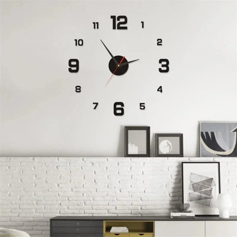 A black and gold frameless acrylic digital wall clock with Roman numerals on a white wall.