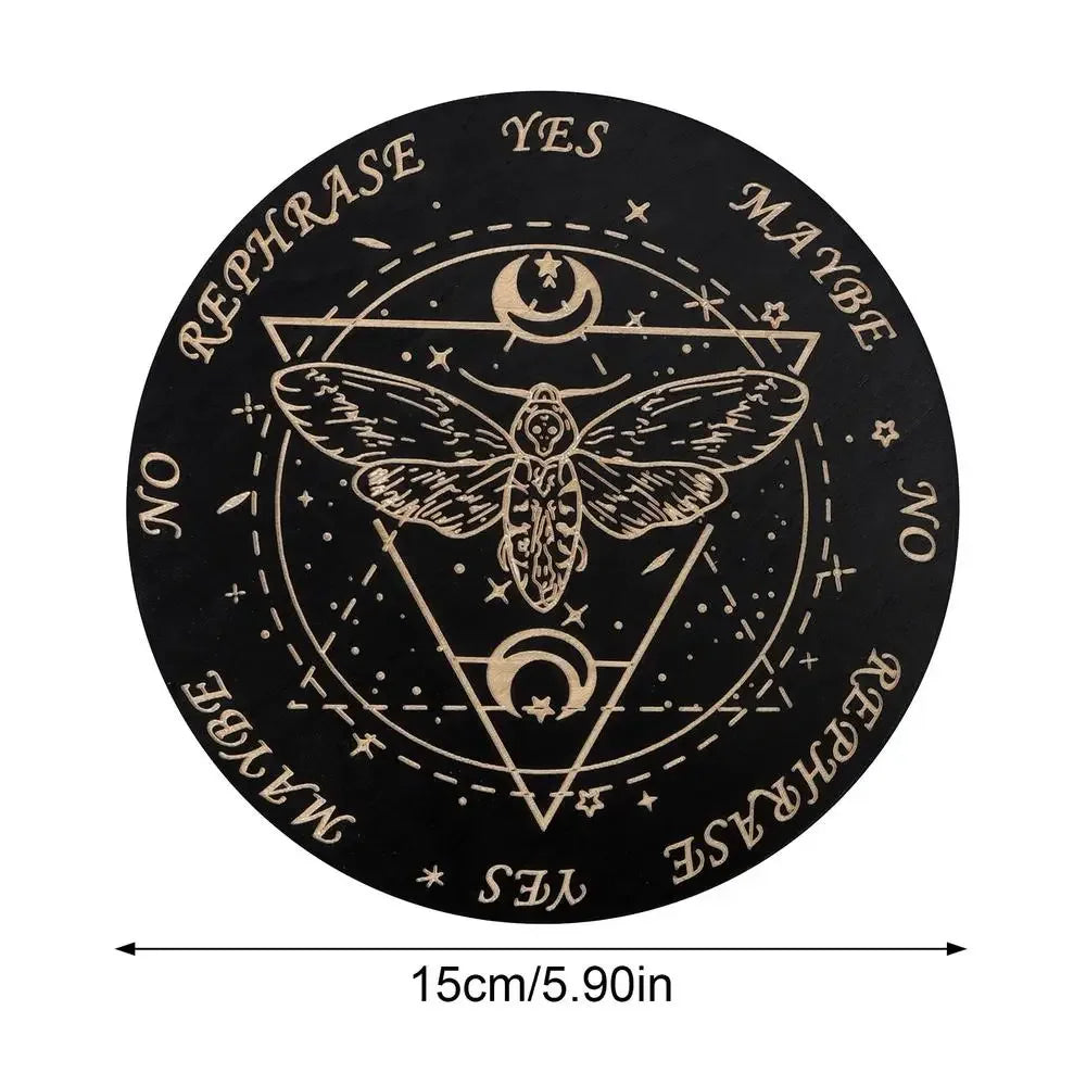 A black wooden pendulum board featuring a pentagram design with celestial symbols and text like YES, MAYBE, NO, and REPHRASE.