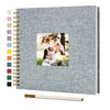 A grey linen cover scrapbook album with a photo of a man holding a woman.