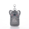 A gray, fluffy bear keychain with an attached card holder.