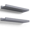 A set of two rustic floating wood shelves in a gray finish mounted on a white wall.